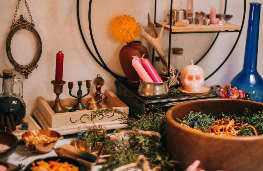 A mystical home altar featuring candles, herbs, and artifacts for a magical ambiance.